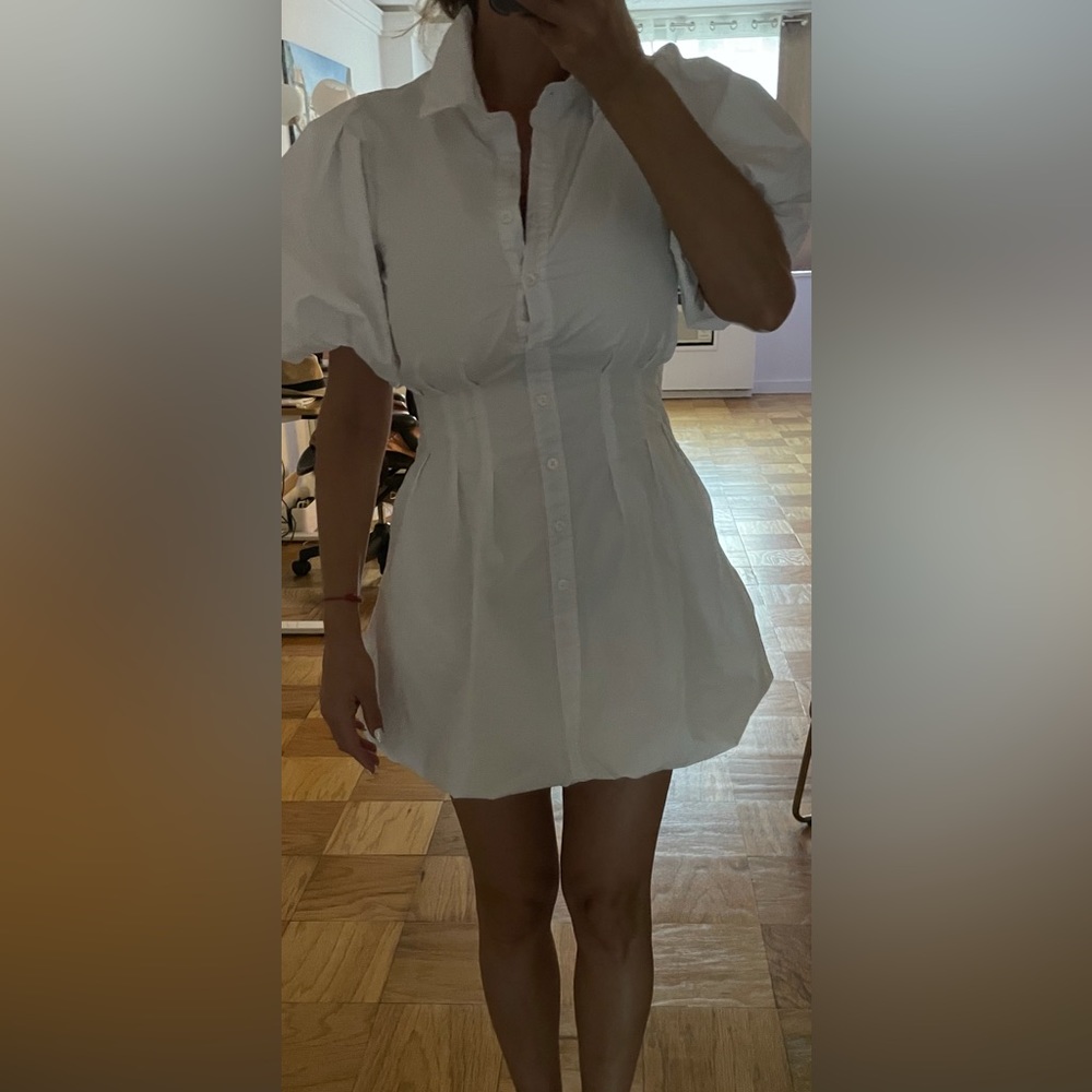 New mini white summer dress with two pockets and zipper on the side.